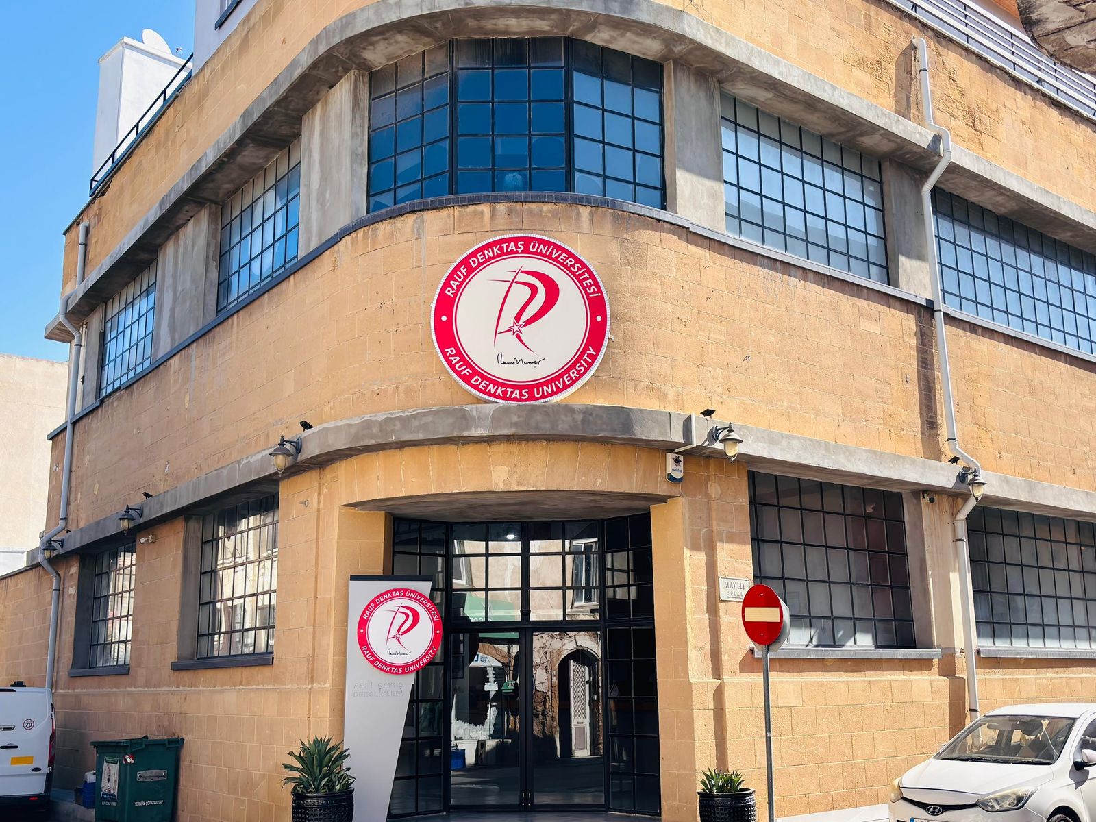 Rauf Denktas University building in the walled city of Nicosia with the university emblem